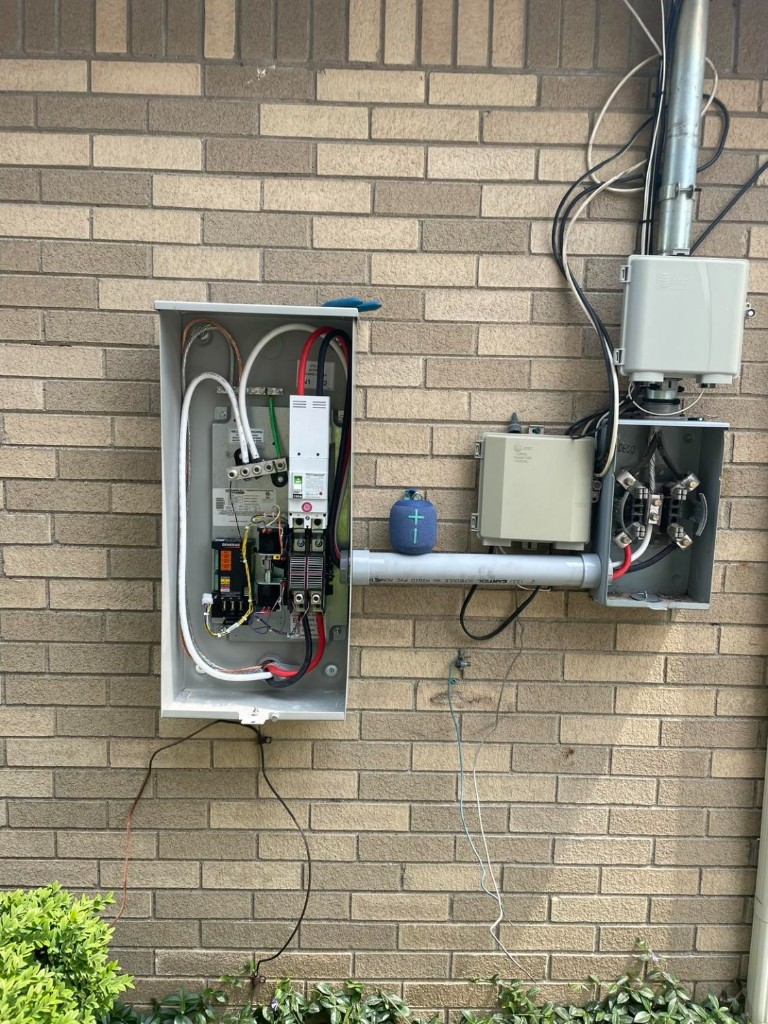 Generator transfer switch and meter socket installation on brick